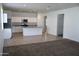 Modern kitchen features granite countertops, stainless appliances, and tile floors at 30918 W Mulberry W Dr, Buckeye, AZ 85396