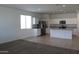 Bright open concept kitchen with stainless steel appliances and island at 30918 W Mulberry W Dr, Buckeye, AZ 85396