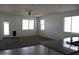 Open concept living room boasts natural light and neutral flooring at 30918 W Mulberry W Dr, Buckeye, AZ 85396