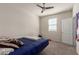 Bedroom featuring carpet, ceiling fan, natural light and neutral paint for a calm and airy feel at 3113 N 303Rd Dr, Buckeye, AZ 85396