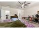 Bedroom with wood-look floors, ceiling fan, and lots of natural light at 3113 N 303Rd Dr, Buckeye, AZ 85396