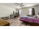 Bedroom with wood-look floors, ceiling fan, and lots of natural light at 3113 N 303Rd Dr, Buckeye, AZ 85396