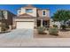 Charming two-story home featuring a two-car garage, neutral stucco, and a well-maintained front yard at 3113 N 303Rd Dr, Buckeye, AZ 85396