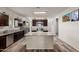 Modern kitchen boasts stainless steel appliances, granite countertops, and a central island at 3113 N 303Rd Dr, Buckeye, AZ 85396