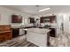 Modern kitchen with stainless steel appliances, granite countertops, and a center island at 3113 N 303Rd Dr, Buckeye, AZ 85396