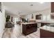 Bright kitchen with an island, stainless steel appliances, granite countertops, and an open floor plan at 3113 N 303Rd Dr, Buckeye, AZ 85396