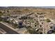 An aerial view of the community with palm trees around the community pool and clubhouse at 3236 E Chandler Blvd # 2003, Phoenix, AZ 85048