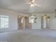 Spacious living room filled with natural light, featuring neutral carpet and open access to the kitchen at 3236 E Chandler Blvd # 2003, Phoenix, AZ 85048