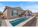 Backyard features a pool, patio, and building exterior at 32567 N 133Rd Ave, Peoria, AZ 85383