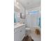 Bright bathroom with a white vanity, tub with shower, and natural light from clerestory window at 32567 N 133Rd Ave, Peoria, AZ 85383