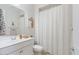 Well-lit bathroom with neutral tones and a shower/tub combo is complemented by modern fixtures at 32567 N 133Rd Ave, Peoria, AZ 85383