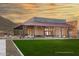 Community center building featuring neutral walls and exterior seating on green lawn at 32567 N 133Rd Ave, Peoria, AZ 85383