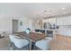 Dining area situated between the kitchen and entry way featuring pendant lights and modern decor at 32567 N 133Rd Ave, Peoria, AZ 85383
