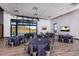 Event space set for a catered event with tables, chairs and view of community green space at 32567 N 133Rd Ave, Peoria, AZ 85383
