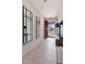 Bright foyer with tile floors, mirrors, and a view of the home's exterior at 32567 N 133Rd Ave, Peoria, AZ 85383