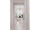 Bright home office with modern light fixture and glass door entry offers a dedicated workspace at 32567 N 133Rd Ave, Peoria, AZ 85383