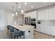 Contemporary kitchen features stainless steel appliances, quartz countertops, and a breakfast bar for modern living at 32567 N 133Rd Ave, Peoria, AZ 85383
