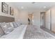 Spacious primary bedroom features neutral tones, recessed lighting, and ensuite bathroom access at 32567 N 133Rd Ave, Peoria, AZ 85383