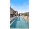 Beautiful backyard pool with ledge loungers and umbrella with mountain views at 32567 N 133Rd Ave, Peoria, AZ 85383