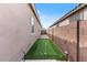 Side yard putting green, complete with flags and clubs at 32567 N 133Rd Ave, Peoria, AZ 85383