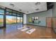 Studio yoga room with large mirror, folding glass door and views of community green space at 32567 N 133Rd Ave, Peoria, AZ 85383
