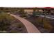Scenic community walking path winding through desert landscape, perfect for active residents and enjoying nature at 32567 N 133Rd Ave, Peoria, AZ 85383