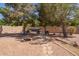 Relaxing backyard with shaded area, fire pit, and cozy seating for outdoor enjoyment at 3381 E Canary Way, Chandler, AZ 85286