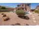 Inviting backyard with a sparkling pool, rock features, and desert landscaping, offering a private retreat at 3381 E Canary Way, Chandler, AZ 85286