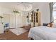 Comfortable bedroom with a built-in bookshelf, soft rug, and a relaxing, sun-lit atmosphere at 3381 E Canary Way, Chandler, AZ 85286