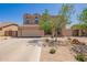 Inviting two-story home with a neatly landscaped front yard and a spacious driveway leading to a garage at 3381 E Canary Way, Chandler, AZ 85286