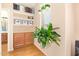 Bright office space with wood floors, built-in shelving, natural light, and an adjacent bathroom at 3381 E Canary Way, Chandler, AZ 85286