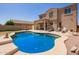 Gorgeous outdoor pool with a tanning ledge and plenty of space for entertaining at 3381 E Canary Way, Chandler, AZ 85286