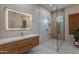 Modern bathroom featuring a glass-enclosed shower, sleek vanity, and contemporary fixtures at 3405 E Knox Rd, Phoenix, AZ 85044