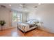 Bedroom with natural light, wood floors, and ceiling fan at 3405 E Knox Rd, Phoenix, AZ 85044