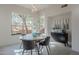 Bright dining room features a round table, grey chairs, and a large window with mountain views at 3405 E Knox Rd, Phoenix, AZ 85044