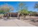 Attractive home exterior showing desert landscaping, an attached garage, and a private driveway at 3405 E Knox Rd, Phoenix, AZ 85044
