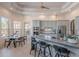 Open concept kitchen featuring granite countertops, gray cabinets, and stainless-steel appliances at 3405 E Knox Rd, Phoenix, AZ 85044