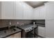 Well-organized laundry room equipped with modern appliances, ample storage, and a sleek design at 3405 E Knox Rd, Phoenix, AZ 85044