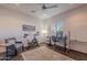 Versatile office space includes ceiling fan, a work area and exercise equipment for a healthy lifestyle at 3405 E Knox Rd, Phoenix, AZ 85044