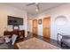 Bright office space featuring a dark wood floor and a modern ceiling fan for comfort at 3405 E Knox Rd, Phoenix, AZ 85044