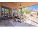 Relaxing outdoor patio featuring a large dining table, comfortable seating, and a ceiling fan for added comfort at 3405 E Knox Rd, Phoenix, AZ 85044