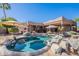 Beautiful backyard pool area showcasing desert landscaping, lounge chairs, and an outdoor dining space at 3405 E Knox Rd, Phoenix, AZ 85044