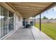 Inviting covered back patio with stylish furniture, perfect for outdoor relaxation and entertaining in the well-maintained backyard at 3821 W Woodridge Dr, Glendale, AZ 85308