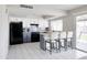Bright kitchen featuring modern appliances, tiled floors and white cabinets at 3821 W Woodridge Dr, Glendale, AZ 85308