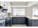 Charming kitchen featuring bright tile backsplash and modern appliances at 3821 W Woodridge Dr, Glendale, AZ 85308