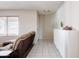 Open-concept living area featuring neutral paint and a tiled entryway at 3821 W Woodridge Dr, Glendale, AZ 85308