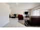 Comfortable living room featuring a large window for natural light and ample seating options at 3821 W Woodridge Dr, Glendale, AZ 85308