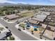 Aerial view showcasing neighborhood park with playground, green spaces, and mountain views at 3847 S 63Rd Dr, Phoenix, AZ 85043