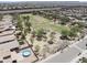 Aerial view of the community showcasing common area, park, and pool at 3847 S 63Rd Dr, Phoenix, AZ 85043