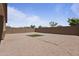 Spacious backyard with gravel, paver patio, block wall, and artificial turf at 3847 S 63Rd Dr, Phoenix, AZ 85043